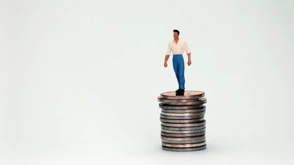 Miniature Man Standing Top Pile Coins — Stock Photo, Image