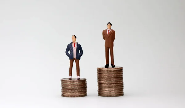 Two Miniature Men Standing Top Two Coins Different Heights — Stock Photo, Image