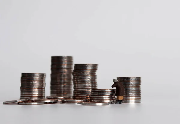 Coin Piles Miniature Woman — Stock Photo, Image