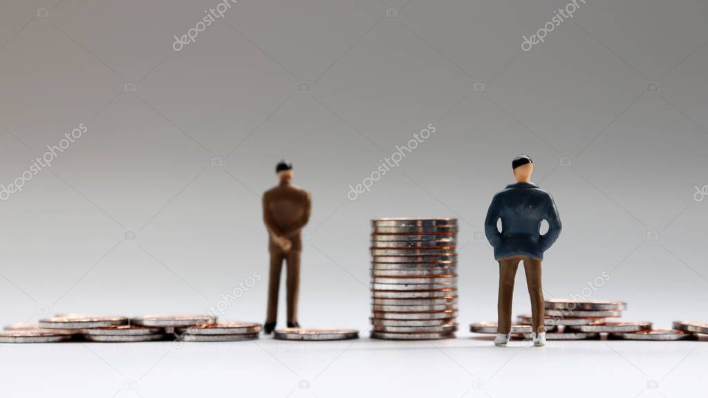 Miniature people and coins.