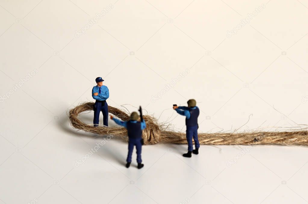 Miniature police and rope.