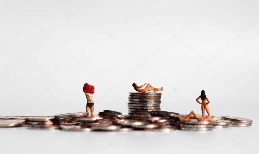 Stop selling women. Coins and miniature women. The concept of women's human rights violations.