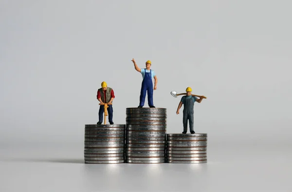 Miniature People Standing Piles Coins Three Different Heights — Stock Photo, Image