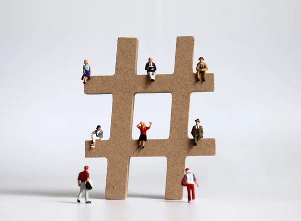 stock image Hashtag and variety of miniature people.