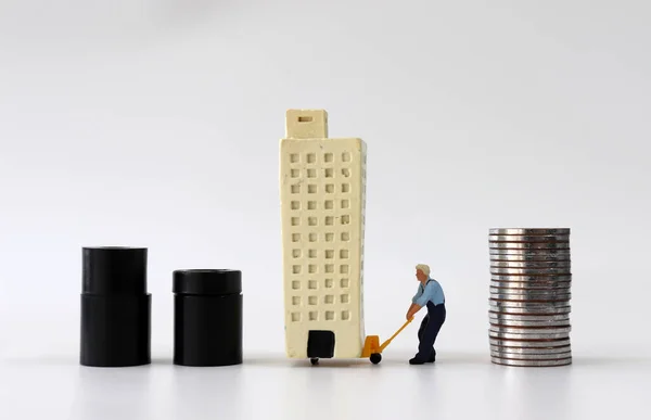 Miniature Man Moving Miniature Building Pile Coins — Stock Photo, Image