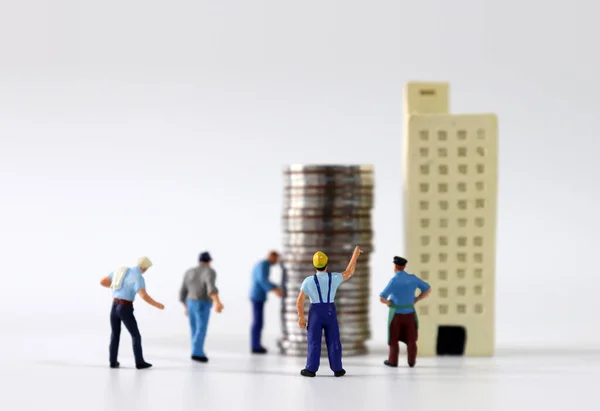 Miniature People Lining Front Buildings Piles Coins — Stock Photo, Image