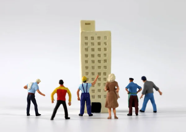 Many Miniature People Gathered Front Miniature Building — Stock Photo, Image