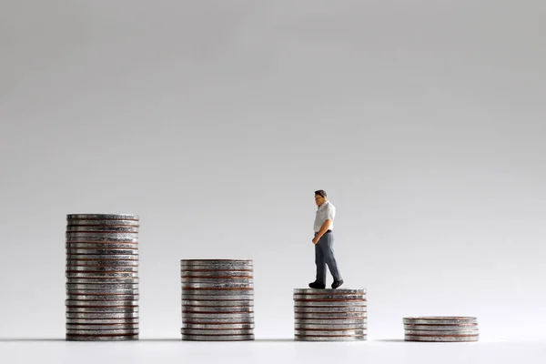 Miniature Man Walking Pile Coins — Stock Photo, Image