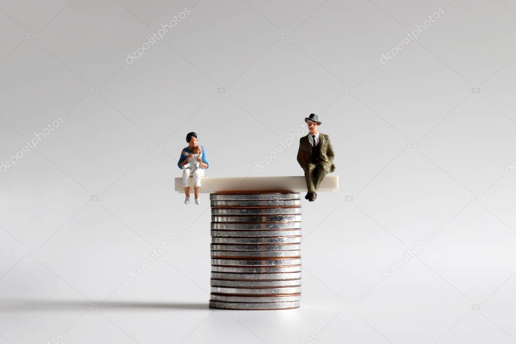 A pile of coins and miniature people.