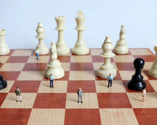 View Miniature People Standing Chess Pieces Chessboard — Stock Photo, Image