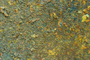 Çürümüş metal pas yüzeyi, yeşil paslı arka plan.