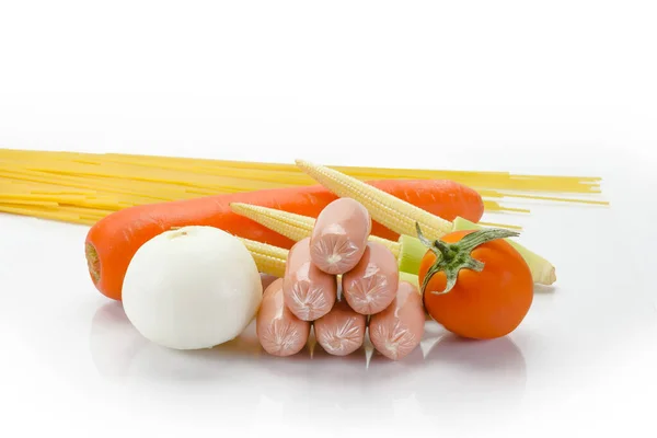 various fresh vegetables with sausage on white background