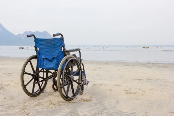 wheelchair on the beach in summer