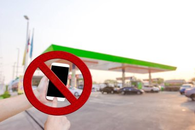Don't use your mobile phone in gas station clipart
