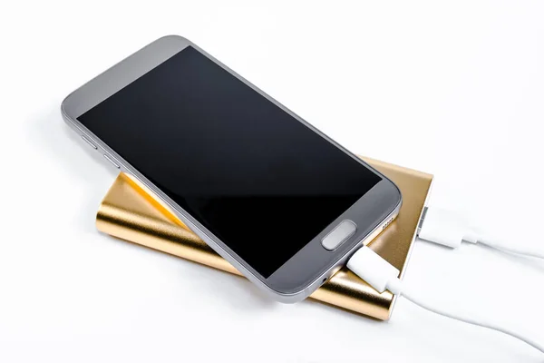 Arkaplanda Akıllı Telefonları Olan Altın Enerji Bankası — Stok fotoğraf