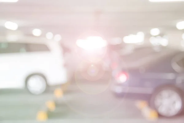 Car parking lot interior blur background with Lens Flare of Illustration,Abstract Blurred