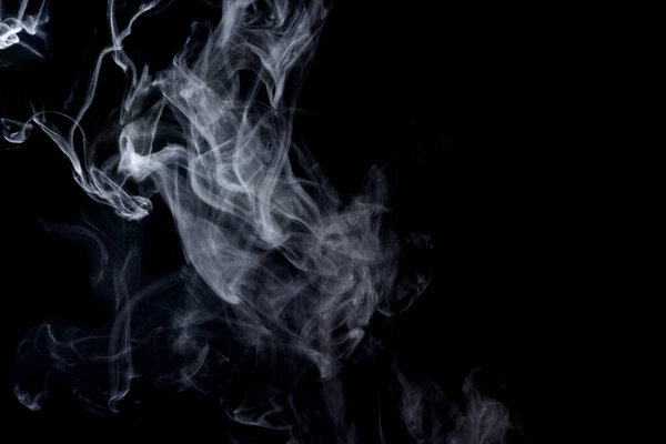 Abstract  powder or smoke isolated on black background