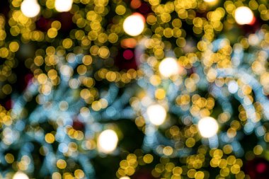 Noel ışıkları ve Yeni Yıl 'ın renkli turuncu kırmızı bokeh arka planı