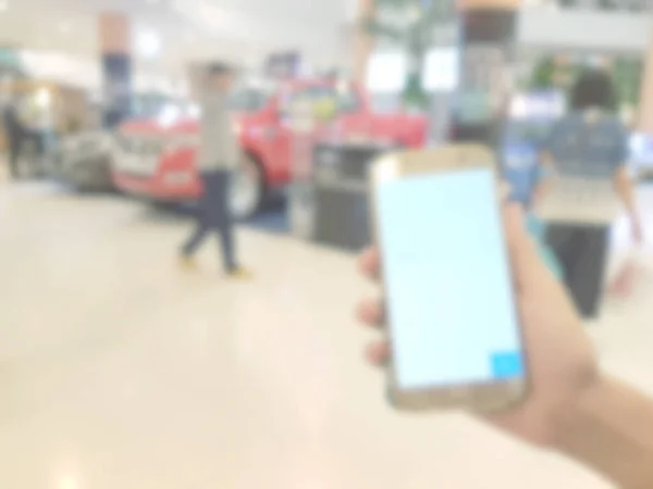 Hand Hält Handy Einkaufszentrum Hintergrund Verschwimmt — Stockfoto