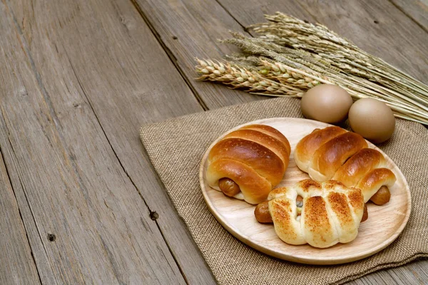 Sausage Bread Wheat Ears Sack Wooden Background — Stock Photo, Image