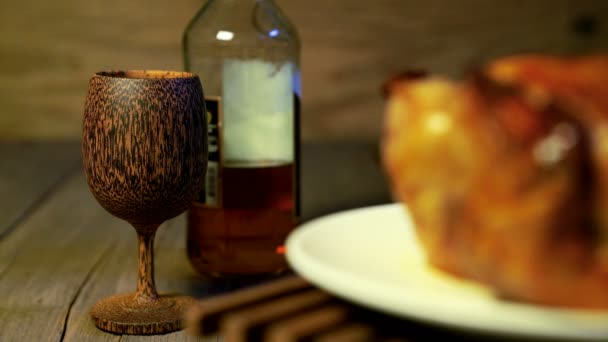 Brandy Wooden Glass Liquor Bottle Blur Roasting Chicken Rotating — Stock Video