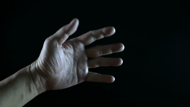 Hand Moving Light Black Background — Stock Video