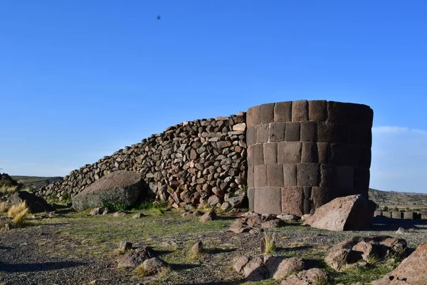 Lagarto chullpa, the most famous Sillustani tombThe chullpas were placed in the top of a small hill. Between the most famous, we find the Lagarto chullpa, called like that due to the big stone blocks of that are on the foundation.