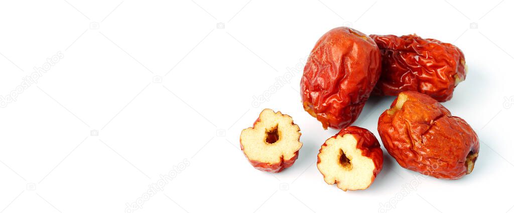 dried unabi fruit or jujube with sliced on white background. Chinese dried red date fruit. copy space for text.