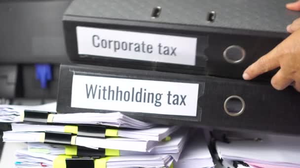 Stack Taxes Binders Report Concept Document Withholding Tax Corporate Tax — Vídeo de Stock