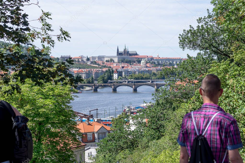 Charles Bridge and Prague Castle from Vysehrad with people silhouettes