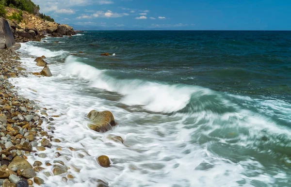Sea waves roll on the stone shore .Southern coast of Crimea