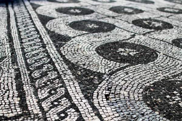 Roman mosaic black and white representing a decoration. Chain and swirl depicted in a mosaic in Ostia Antica, 2nd century.