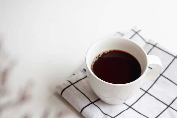 Cup of hot coffee on white background.