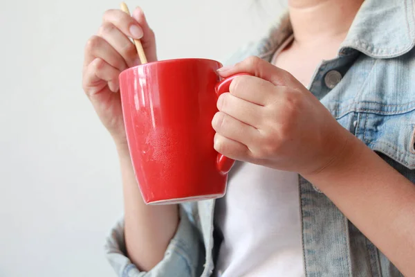 woman hands holding red mug of hot tea in morning.Drink Tea relax cozy day. happy concept.