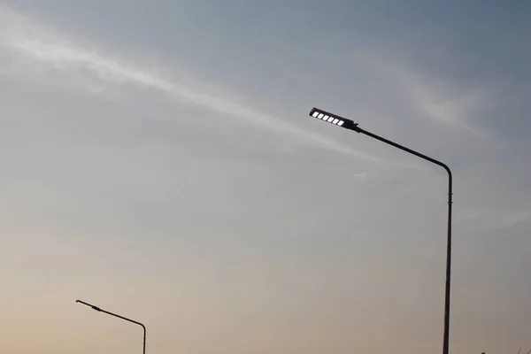 Light pole with twilight sky.