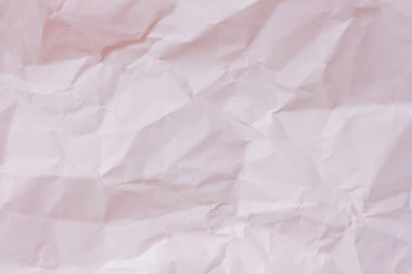Arkaplan için açık pembe buruşmuş kağıt dokusu.