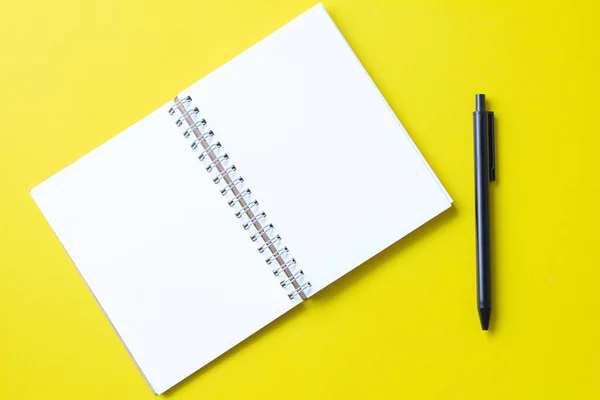 Notebook Pen Yellow Background — Stock Photo, Image