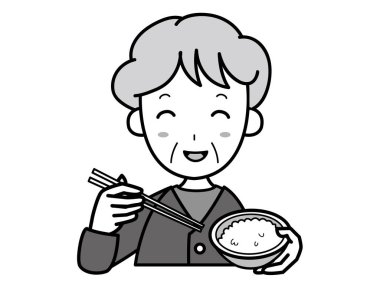 Büyükanne gülümseyerek pilav yiyor.