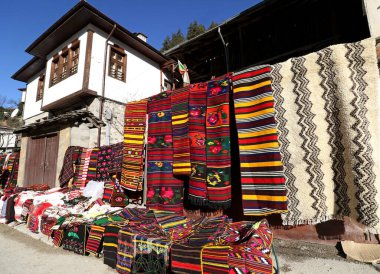 Colorful rugs in the Rhodope village of Shiroka Luka, Bulgaria clipart