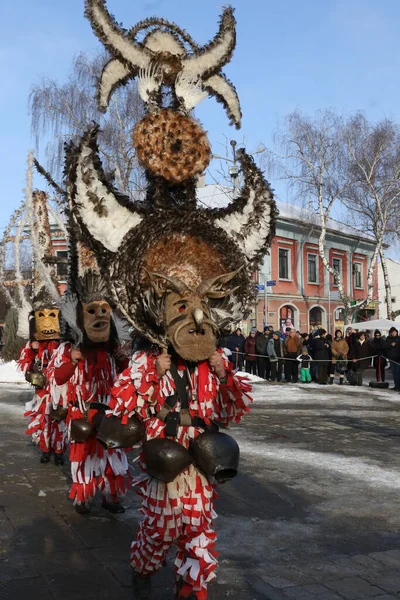 Breznik, Bulgaria - January  21, 2017: Unidentified people with traditional Kukeri costume are seen at the Festival of the Masquerade Games Surova in Breznik, Bulgaria.