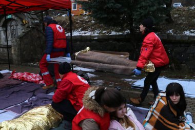 Sofia, Bulgaria - December 5, 2018: Volunteers from the organization of the Bulgarian Red Cross participate in training with a fire service. They help provide first aid to people after an earthquake and fire