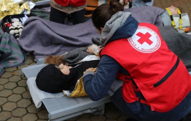 Sofia, Bulgaria - December 5, 2018: Volunteers from the organization of the Bulgarian Red Cross participate in training with a fire service. They help provide first aid to people after an earthquake and fire
