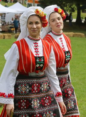 Vratsa, Bulgaria - June 24, 2018: People in traditional authentic folk costumes, recreating the traditional Bulgarian northern wedding on National folklore fair 