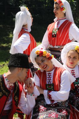 Vratsa, Bulgaria - June 24, 2018: People in traditional authentic folk costumes, recreating the traditional Bulgarian northern wedding on National folklore fair 