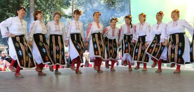Vratsa, Bulgaria - June 24, 2018: People in traditional authentic folk costumes, recreating the traditional Bulgarian northern wedding on National folklore fair 