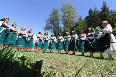 Vratsa, Bulgaria - June 24, 2018: People in traditional authentic folk costumes, recreating the traditional Bulgarian northern wedding on National folklore fair 