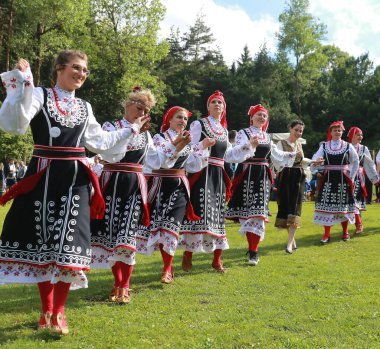 Vratsa, Bulgaria - June 24, 2018: People in traditional authentic folk costumes, recreating the traditional Bulgarian northern wedding on National folklore fair 