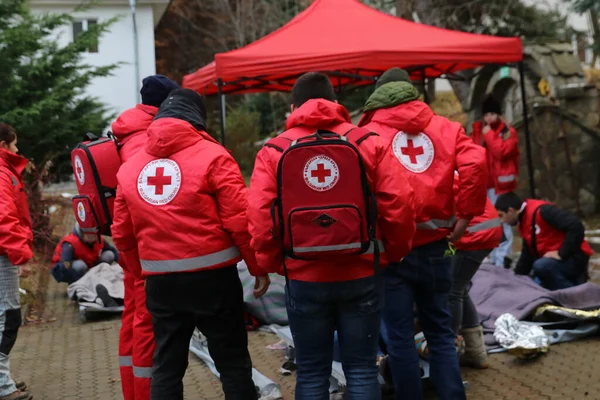 Sofia, Bulgaria - December 5, 2018: Volunteers from the organization of the Bulgarian Red Cross participate in training with a fire service. They help provide first aid to people after an earthquake and fire