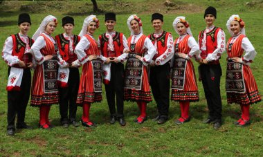 Vratsa, Bulgaria - June 24, 2018: People in traditional authentic folk costumes, recreating the traditional Bulgarian northern wedding on National folklore fair 