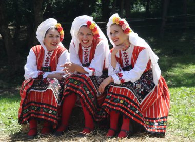 Vratsa, Bulgaria - June 24, 2018: People in traditional authentic folk costumes, recreating the traditional Bulgarian northern wedding on National folklore fair 